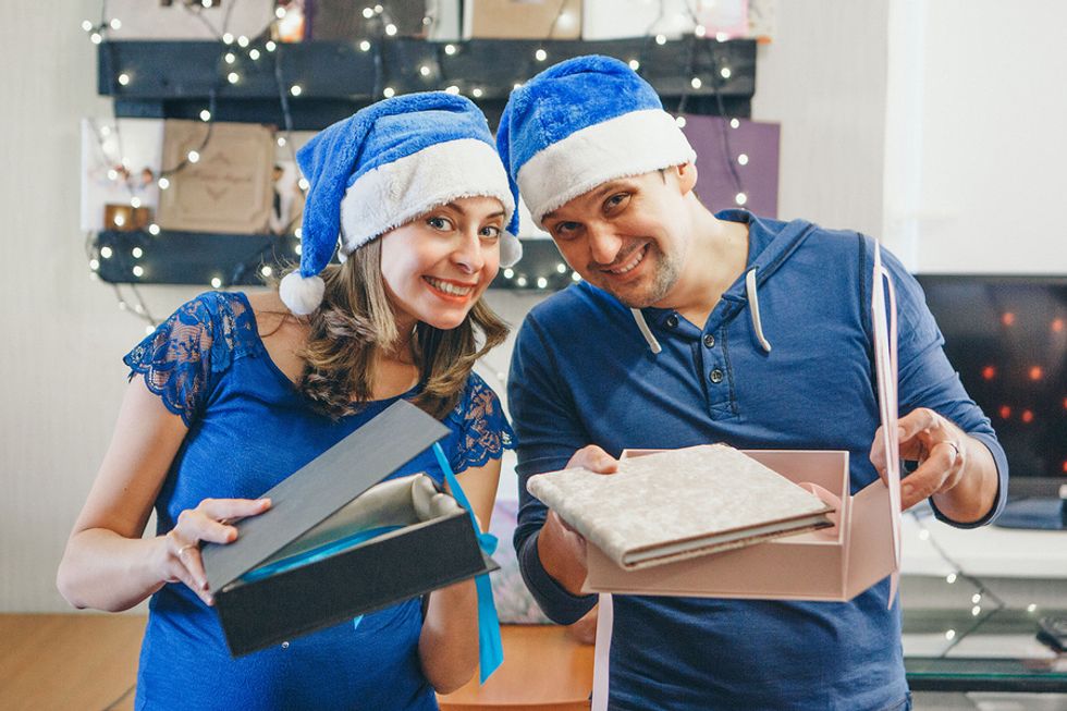 Employees give their boss a book for Christmas
