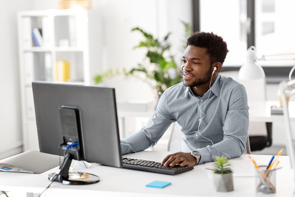 Manager listens to a podcast after receiving a subscription from his employee