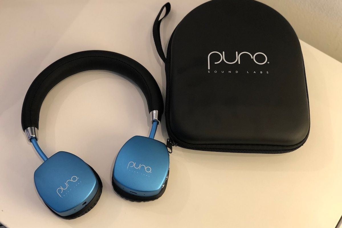 PuroQuiet Headphones in blue metallic and their carrying case