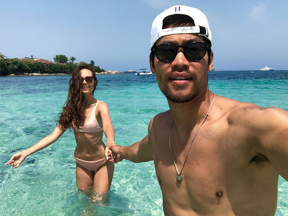 Actor David Lim and wife Marketa Kazdova in the turquoise blue ocean in Sardinia.