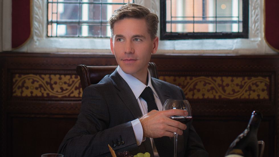 Brian Dietzen "Jimmy Palmer" of NCIS holding a glass of wine and reflecting.