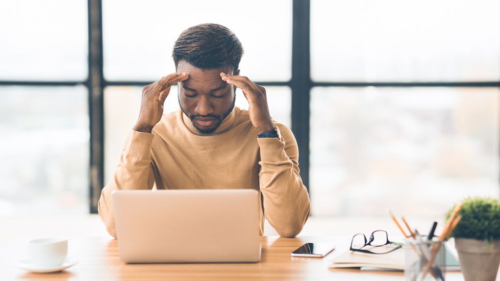Professional man upset about his demotion at work