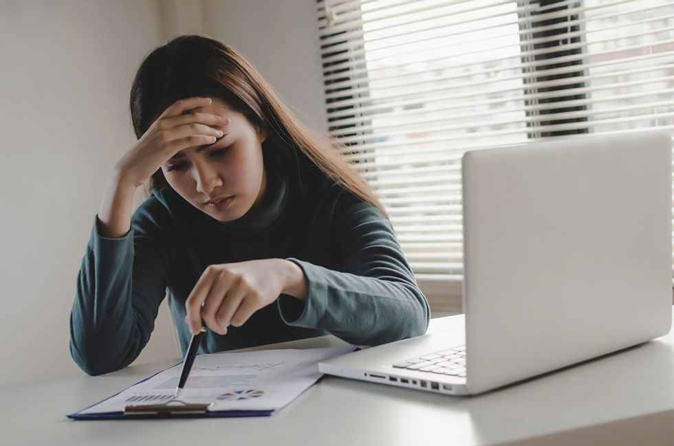 A demoted employee works on a new project at work