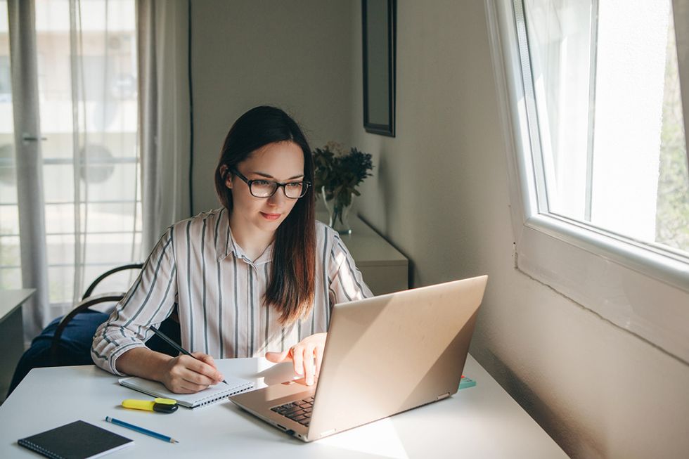 Professional woman keeps her New Year's resolution by working on her career