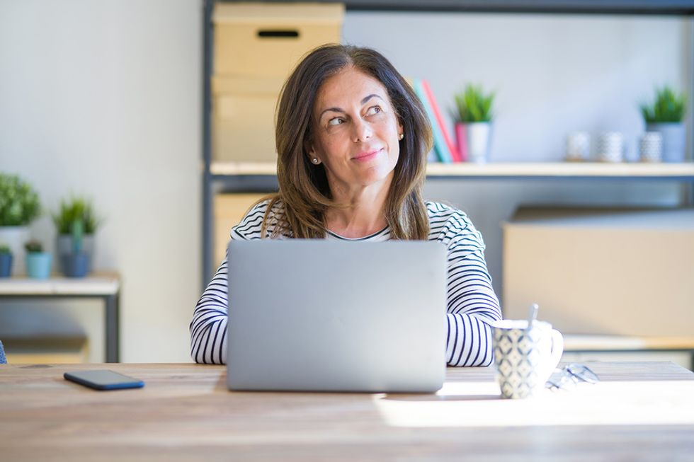 Professional woman thinking about the regrets she has in her career