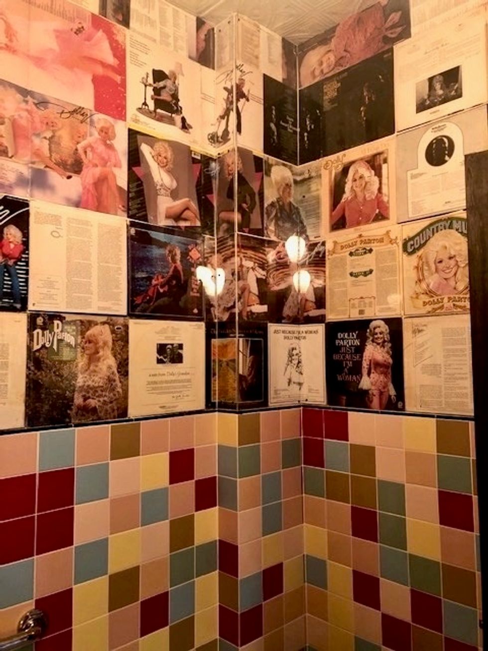 This NYC bar's bathroom is covered in Dolly Parton records as a tribute