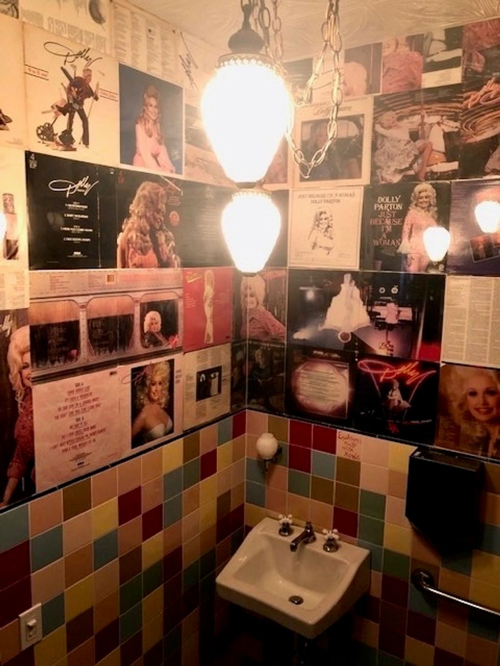 This NYC bar's bathroom is covered in Dolly Parton records as a tribute
