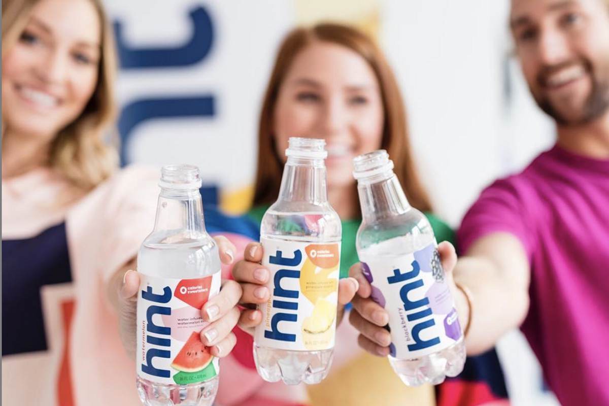 3 friends holding hint water bottles