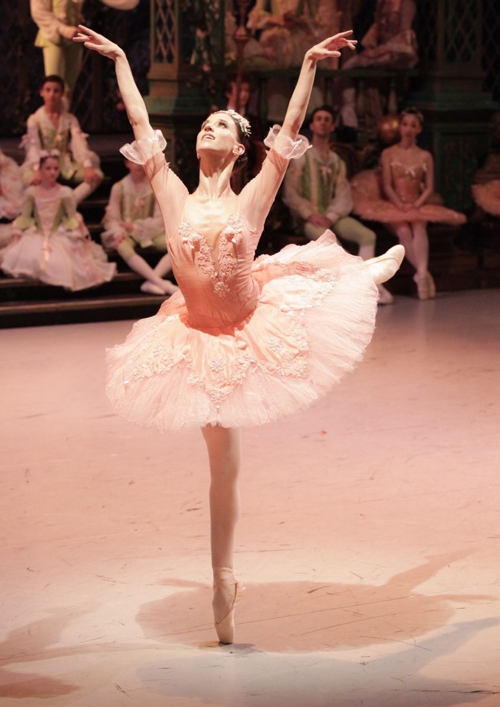 Maria Seletskaya wearing a pink tutu performing an arabesque balance on pointe
