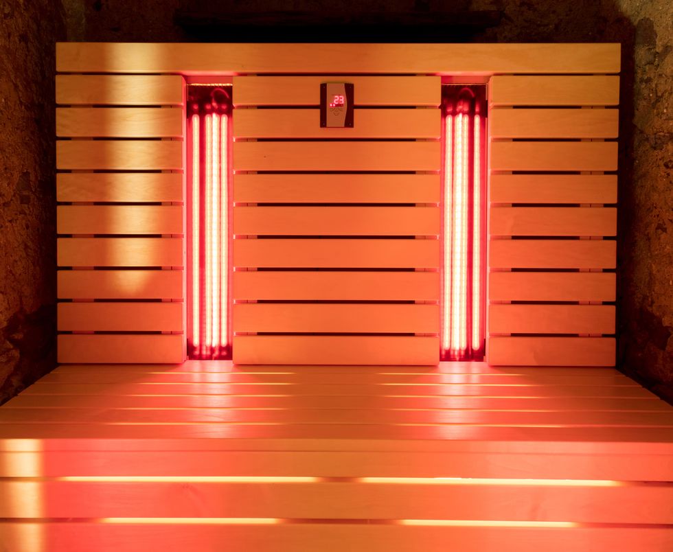 Interior of an infrared sauna, with glowing red lights