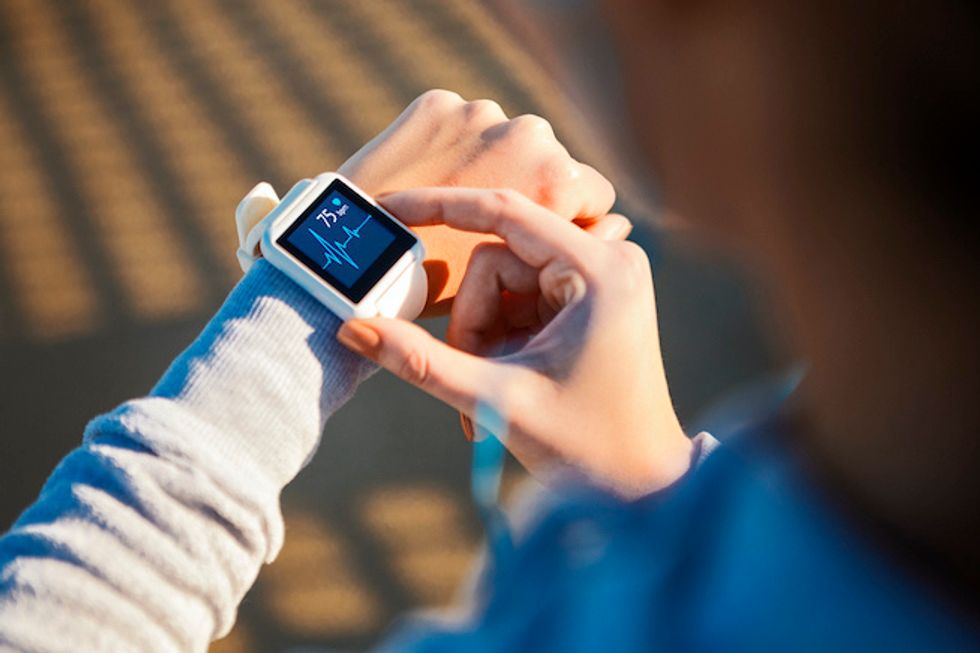 A woman wearing a smartwatch on her wrist