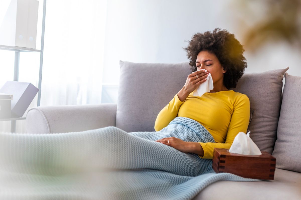 Stock image of a woman with the flu