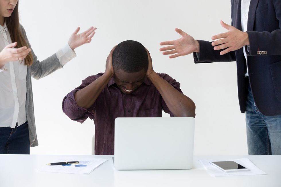 Man annoyed by his co-workers