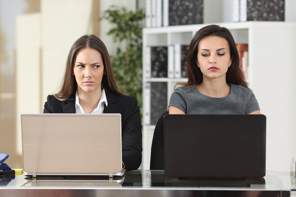 Woman sits next to her annoying co-worker