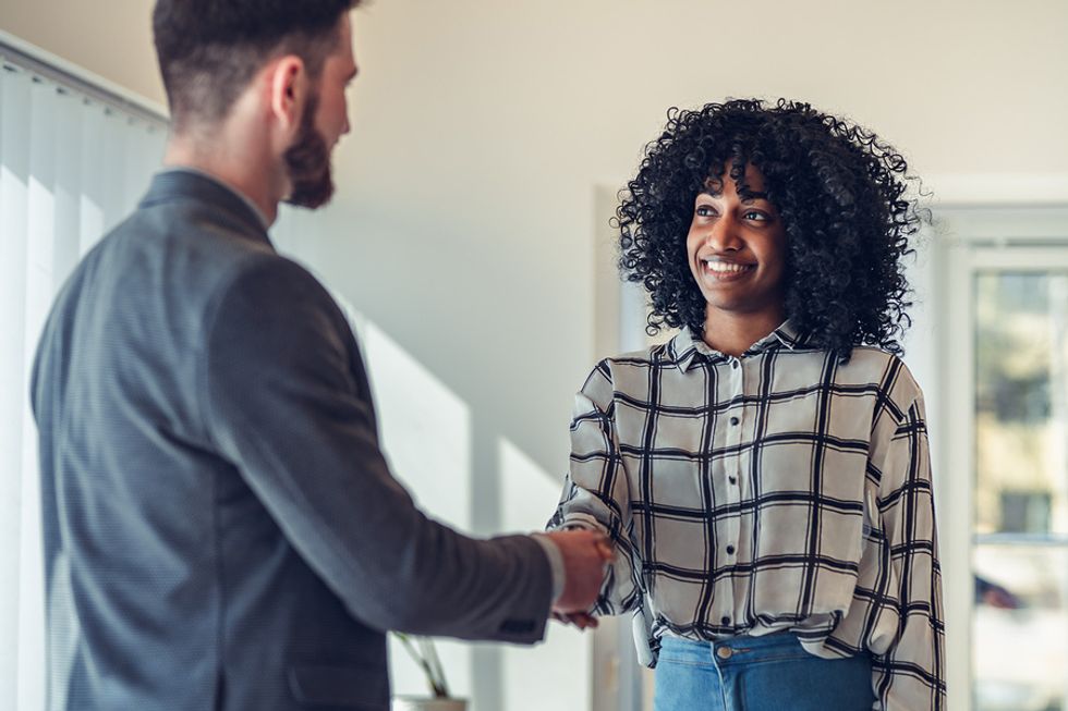 Professional woman thanks her boss for being her reference