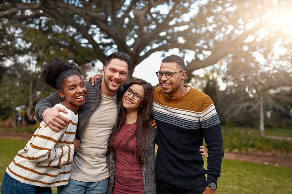 Group of friends hang out after prioritizing work-life balance in their lives
