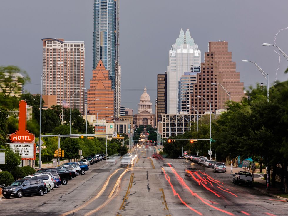 Blurred motion view of cars driving in Austin cityscape, Texas, United States