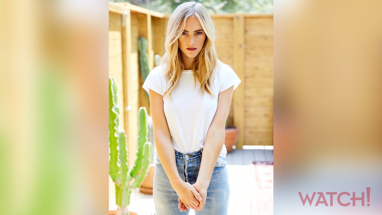 Emily Wickersham in a white T-shirt and jeans.