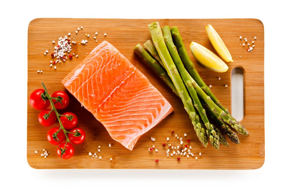 Fresh raw salmon steak on cutting board