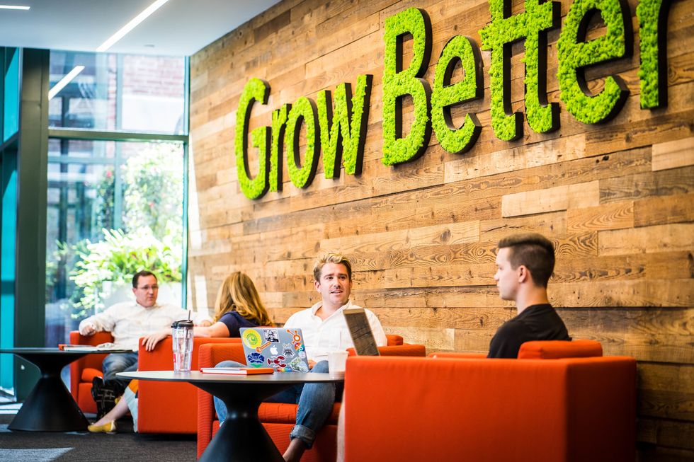 HubSpot employees collaborate in a relaxed setting.