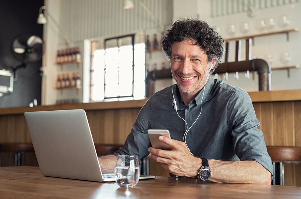 Older man updates his resume, cover letter, and interview strategy for his job search