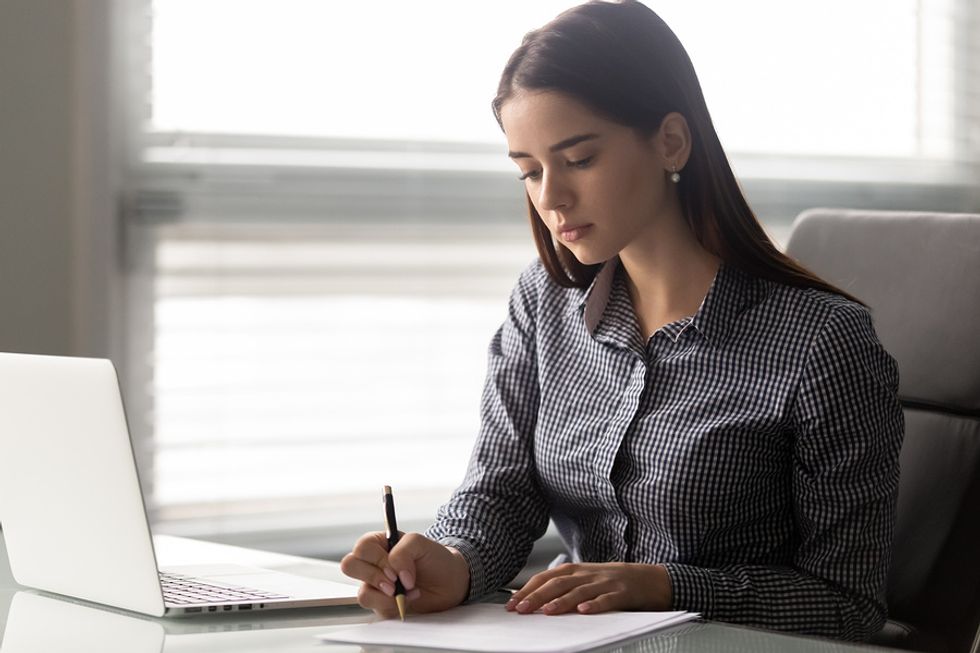 Woman taking note of all her transferable skills