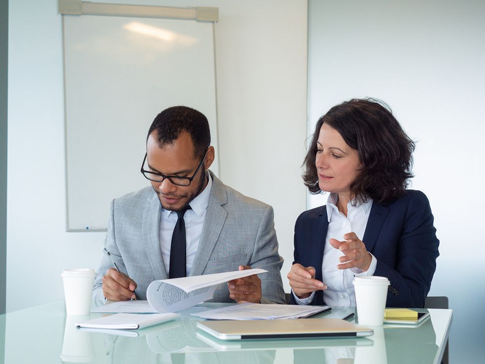 Lawyers going through paperwork