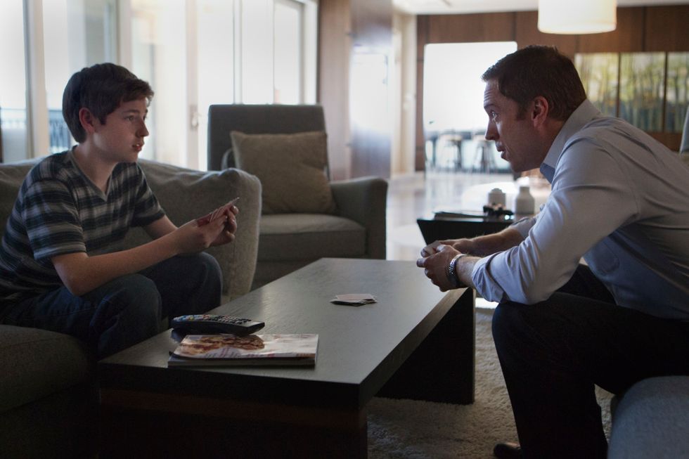 Jackson Pace and Damian Lewis playing cards.