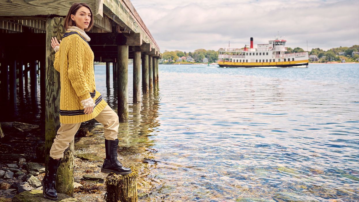 Violett Beane standing at the foot of a pier in Maine.