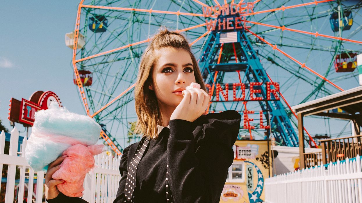 Sami Gayle in front the Ferries Wheel in Coney Island.