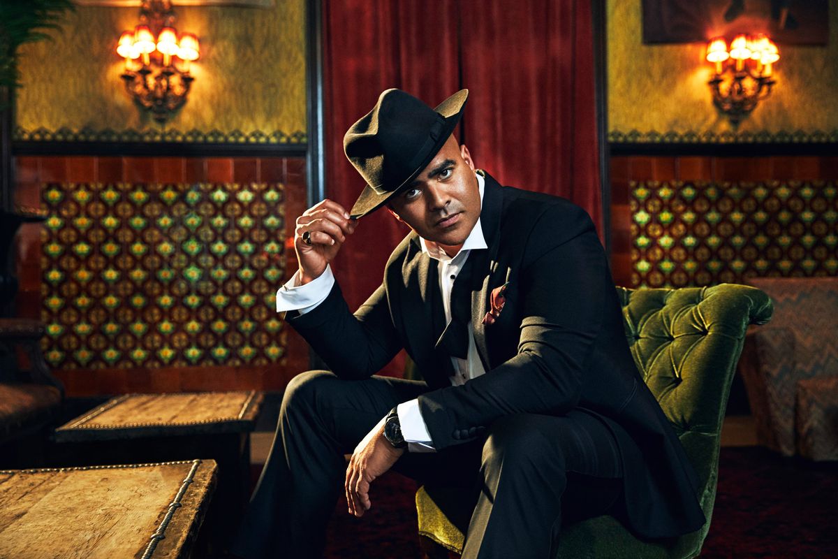 Christopher Jackson in a tux and fedora hat.
