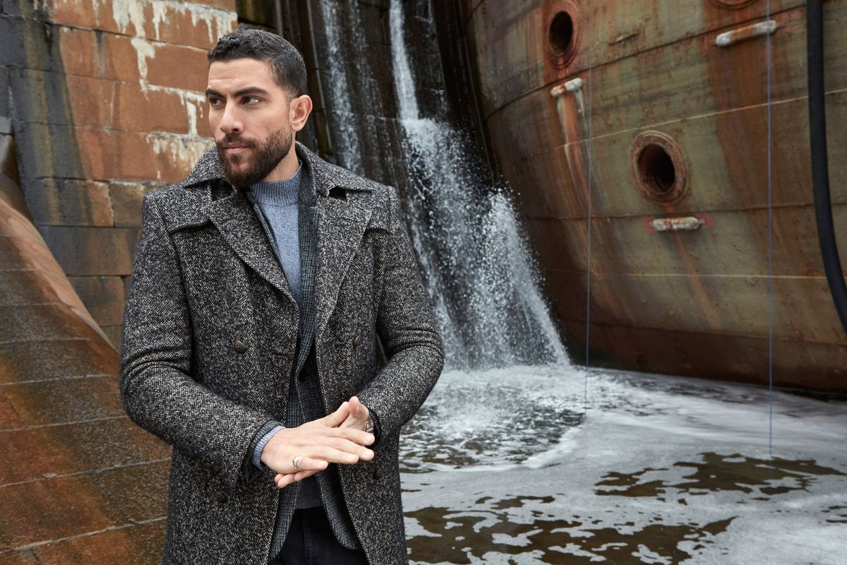 Zeeko Zaki in a cashmere coat in the Brooklyn Navy Yard.