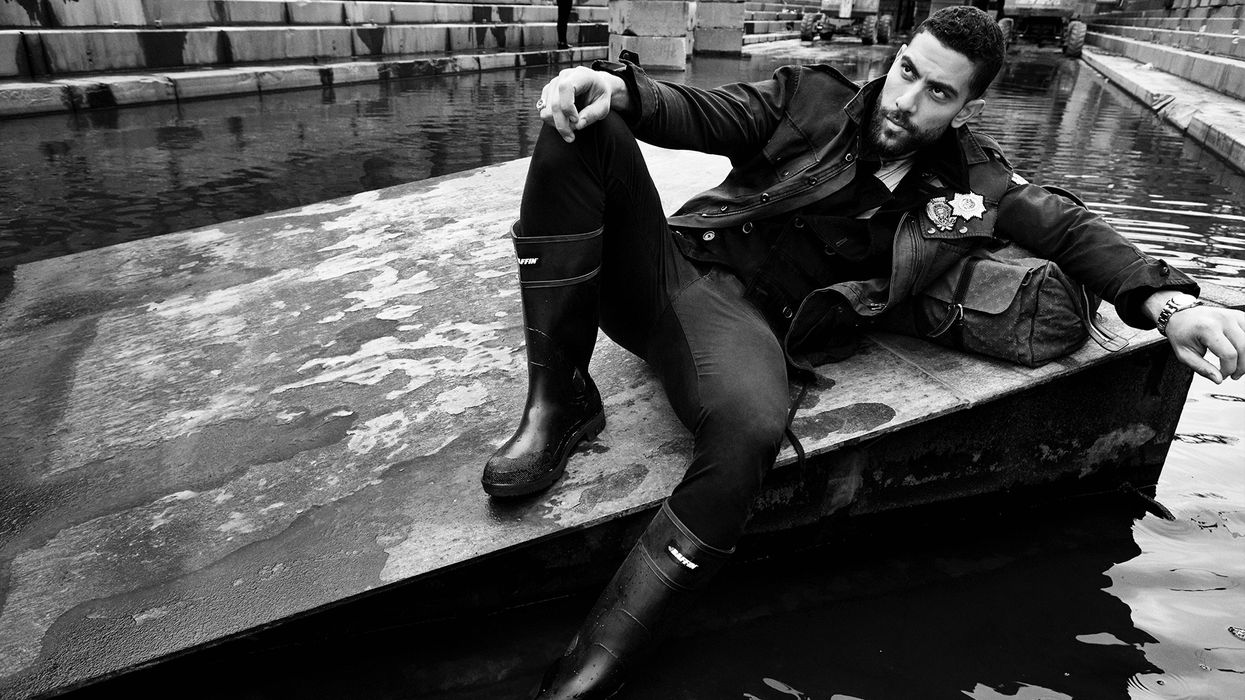 Black and white photo of Zeeko Zaki on a floating dock.
