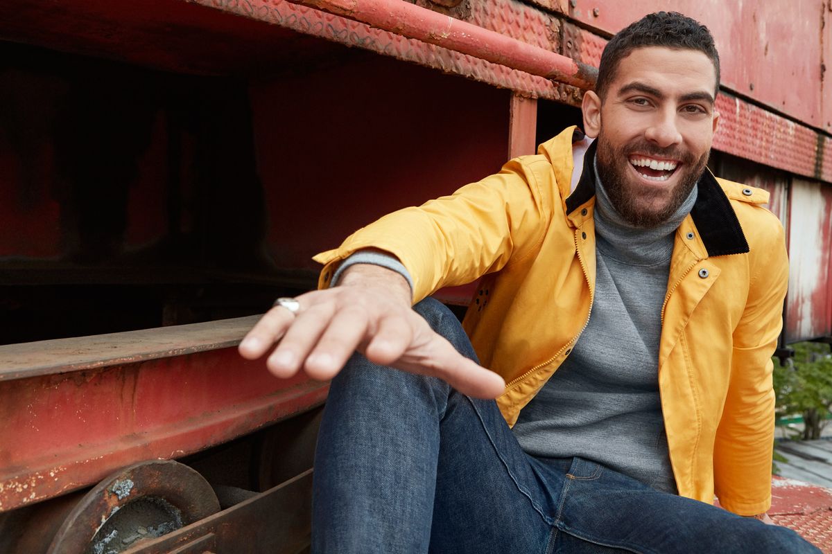 Zeeko Zaki in a yellow rain slicker.
