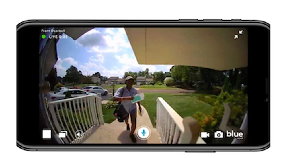 a photo of a smartphone streaming video from a video doorbell by ADT