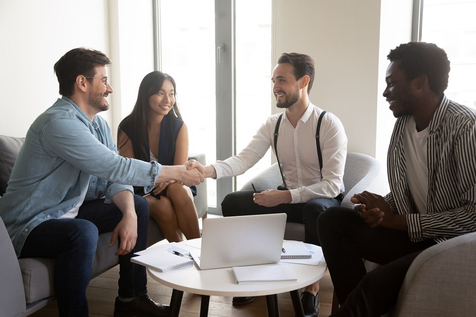 Group of professionals networking during their job search