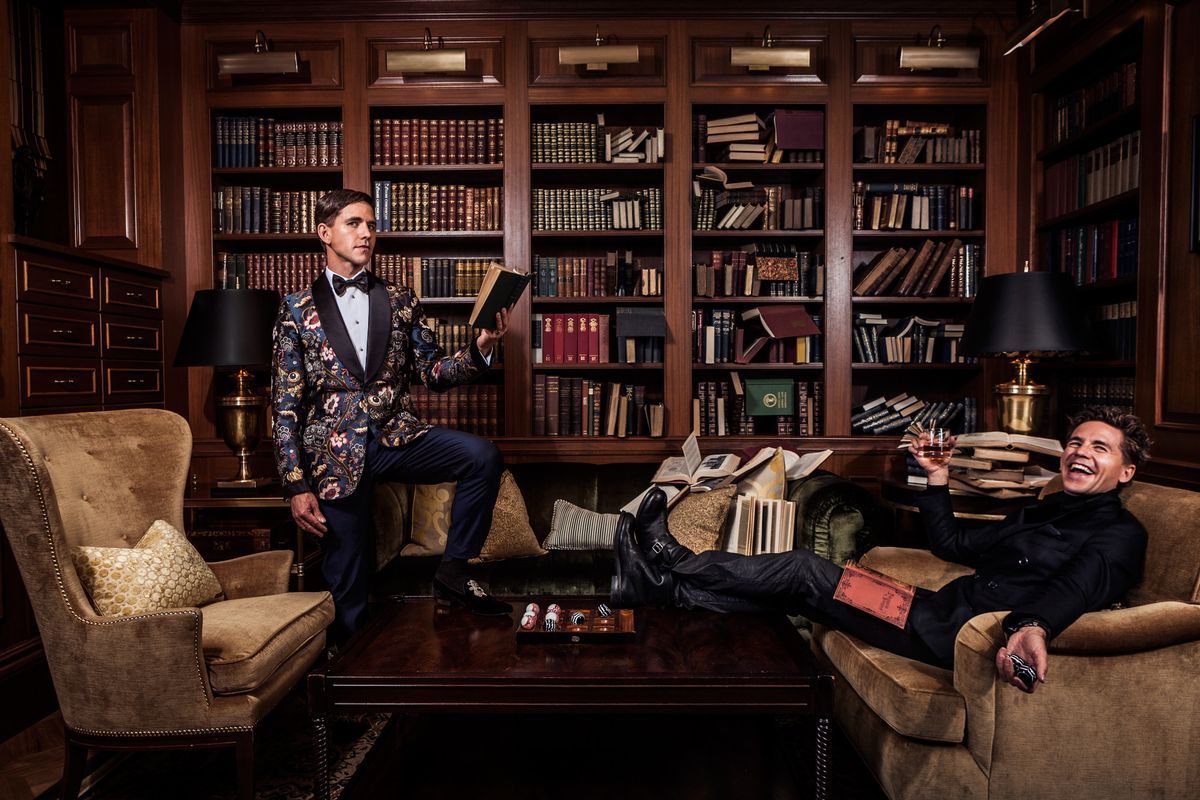 Brian Dietzen of NCIS reading and drinking in a library