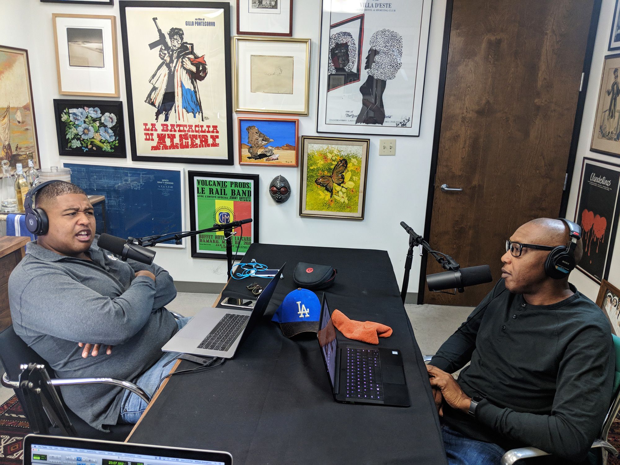 Actor Omar Miller hosting his podcast with brother Terry as a guest.