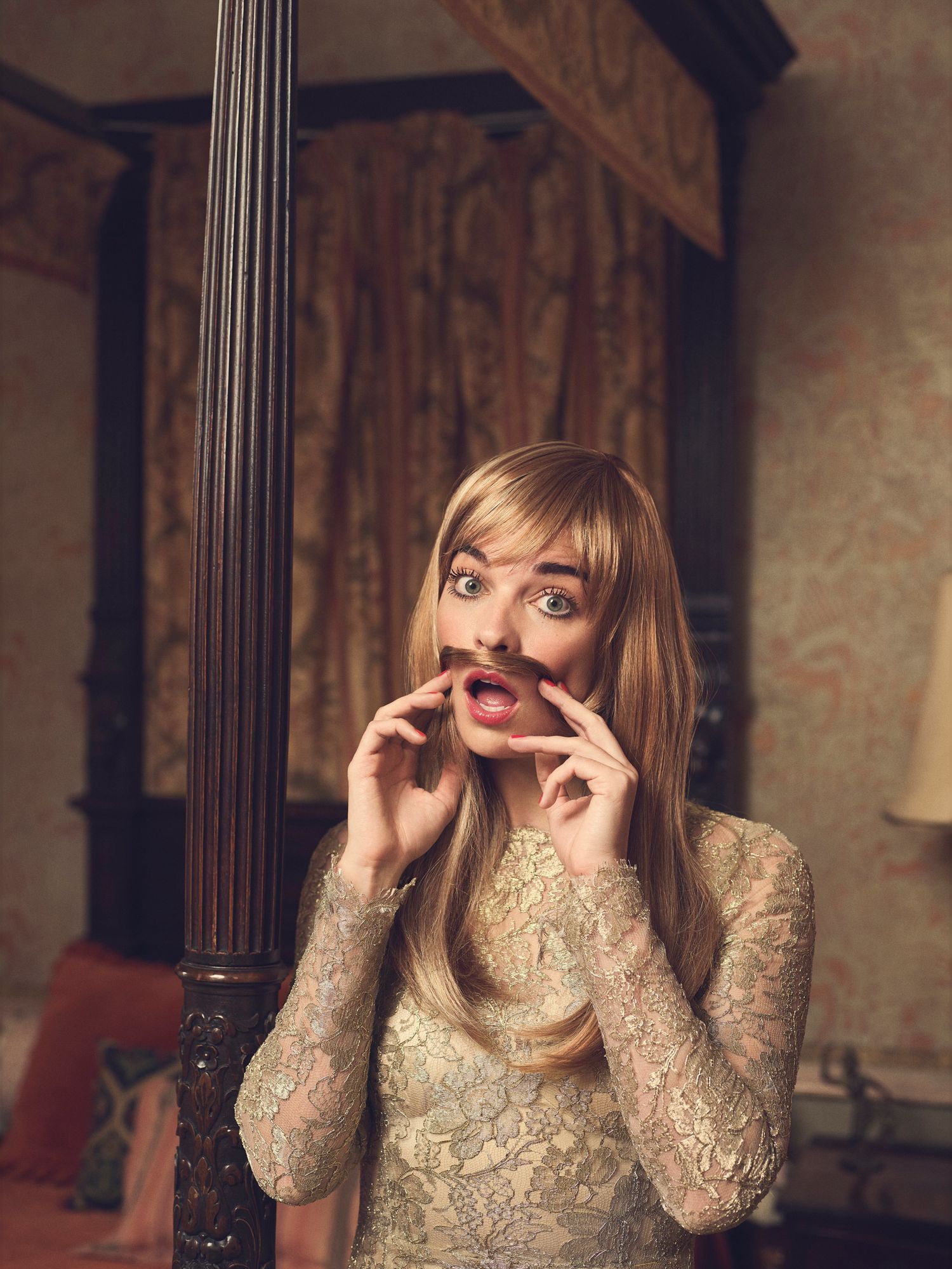 Annie Murphy playfully creating a mustache with her own hair.