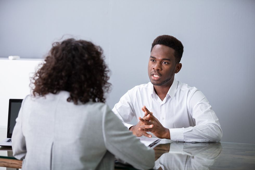 Job seeker answering a behavioral interview question