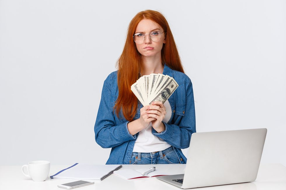 Young woman realizes how much money it costs to get a college degree