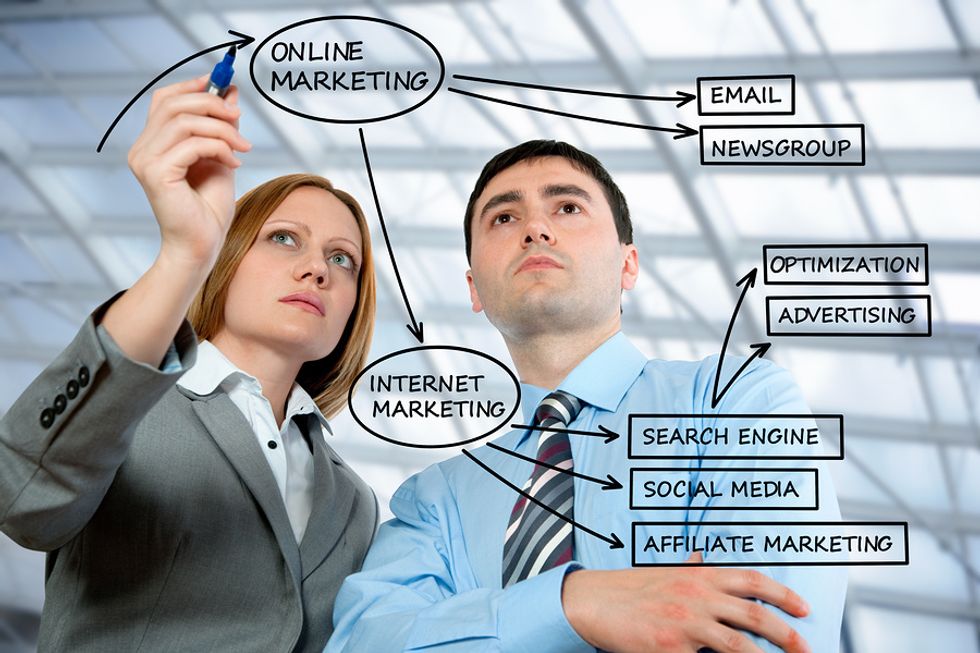 Co-workers discuss the company's content and marketing plan.