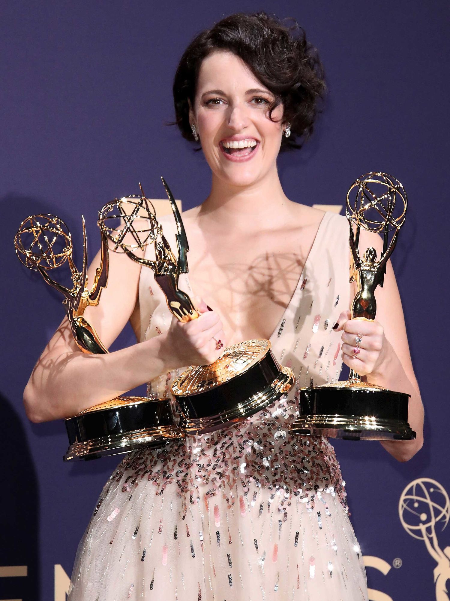 Phoebe Waller-Bridge holding Emmy Award wins.