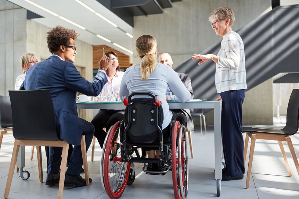 Members of a company's diversity and inclusion committee meet to discuss company culture.