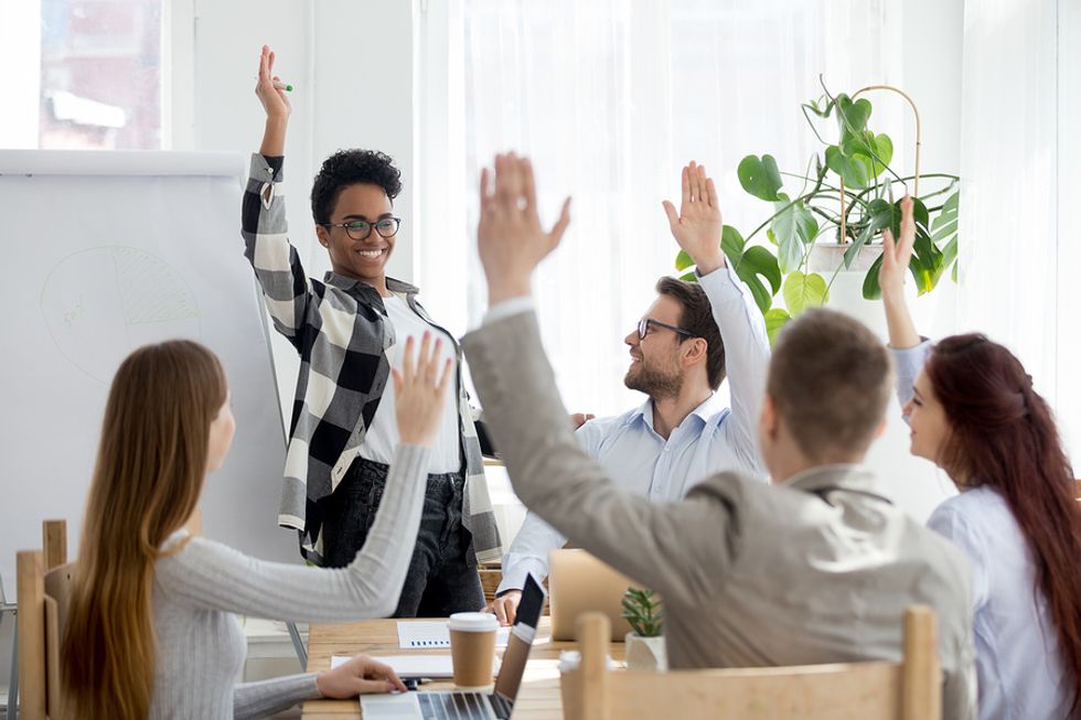 Co-workers have a fun discussion about diversity and inclusion in the workplace.