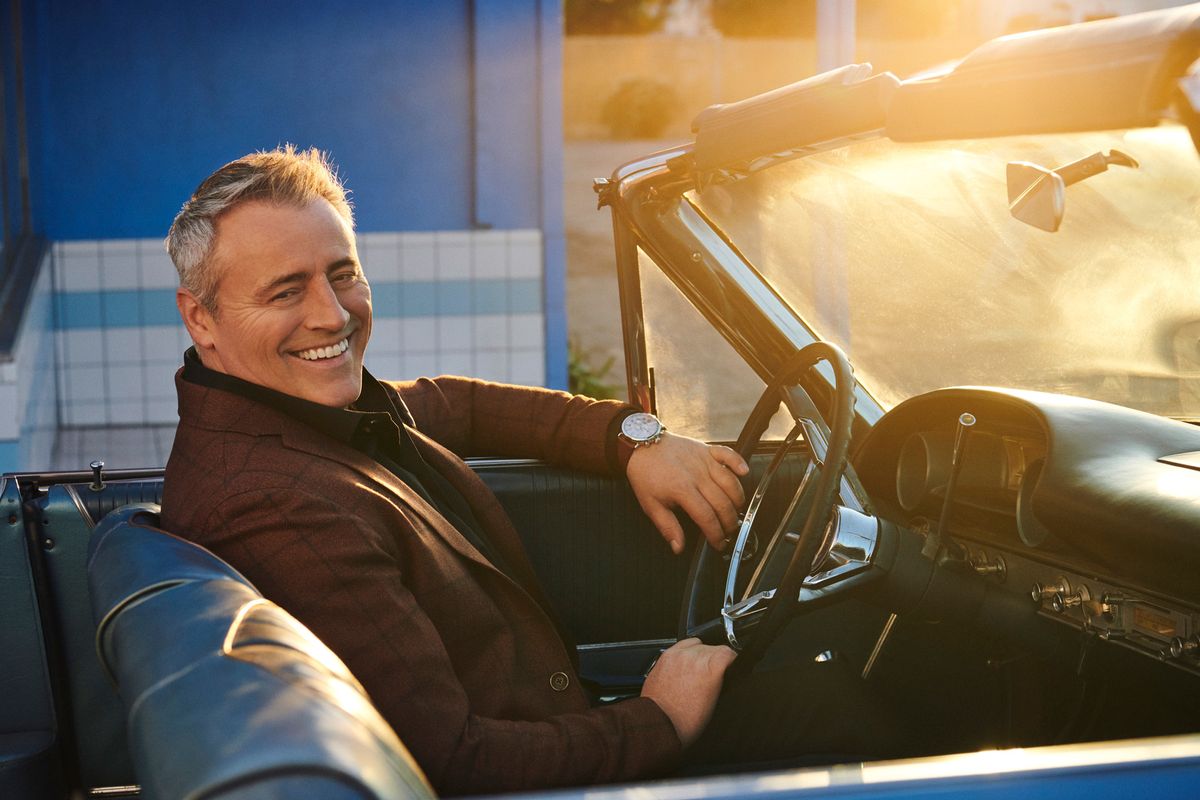 Actor Matt LeBlanc sitting in a classic convertible with the top down.
