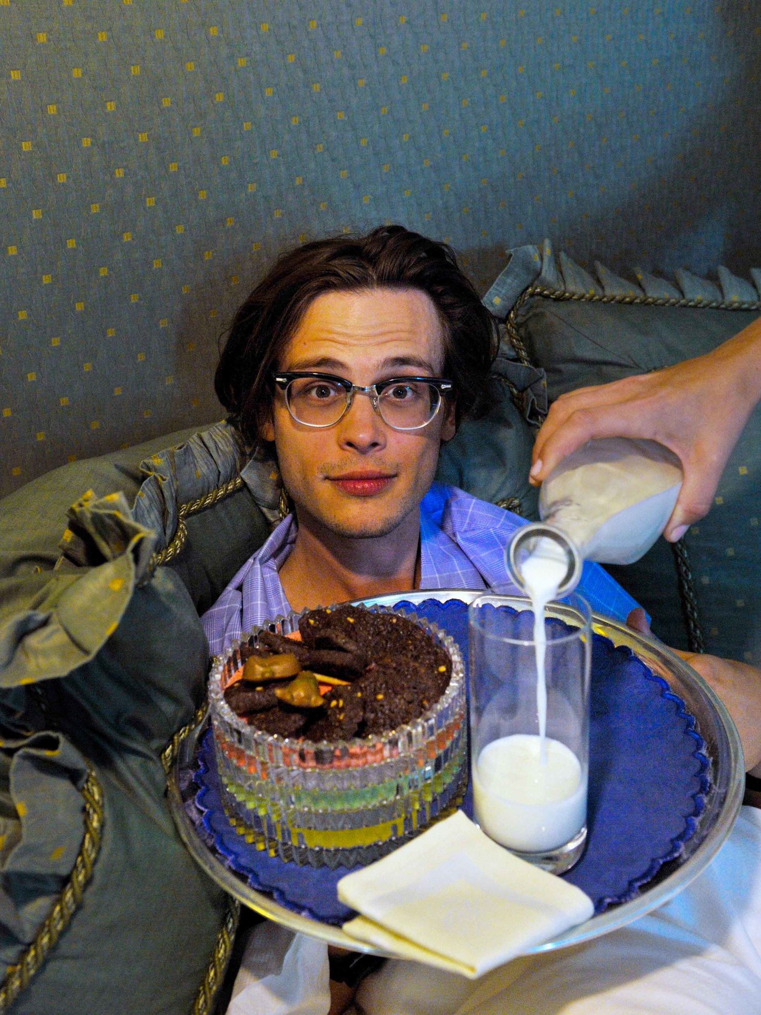 Matthew Gray Gubler being served milk and cookies