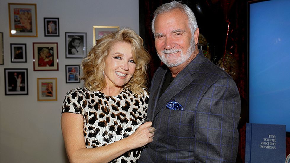 Melody Thomas Scott standing with John McCook for a picture