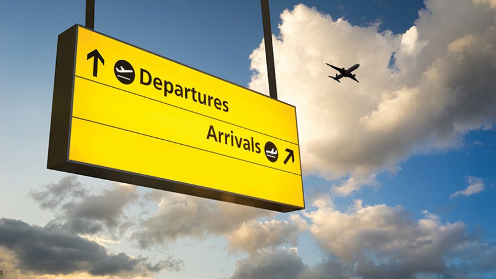 A picture of an airport directional sign.