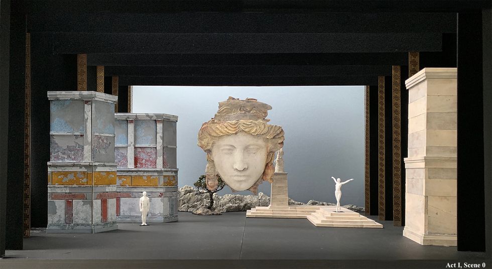 Set design featuring abstracted Greek stone ruins.